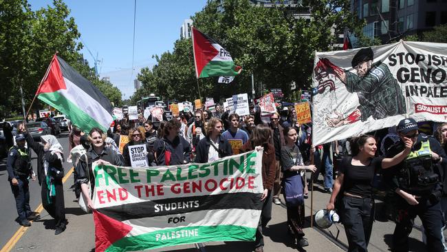 MELBOURNE, AUSTRALIA - NewsWire Photos, NOVEMBER 17, 2023. A student protest calling for Israel to end the war in Palestine held at the American Consulate in Melbourne marches down St Kilda Road.  Picture: NCA NewsWire / David Crosling