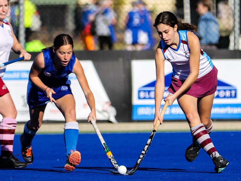 McAuley White's Ruby Hackett (right) duels for the ball with Sailors' Ashleigh Ensbey during the Grafton Hockey Association womens A Grade clash between Silors Roches Hotel and McAuley White.