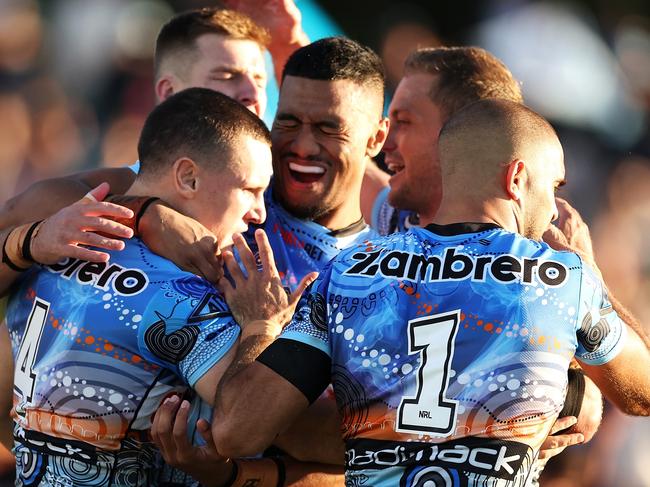 COFFS HARBOUR, AUSTRALIA - MAY 20: Connor Tracey of the Sharks celebrates with his team mates after scoring a try during the round 12 NRL match between Cronulla Sharks and Newcastle Knights at Coffs Harbour International Stadium on May 20, 2023 in Coffs Harbour, Australia. (Photo by Mark Kolbe/Getty Images)