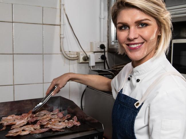 Portraits of former Masterchef contestant Courtney Roulston cooking at The Station Drop In Centre in Sydney on 9th July 2018.  Courtney is teaming up with Club York for "Do Something Day" to serve up a hot breakfast for clients of the centre in Sydney CBD. (Pictures by Julian Andrews).