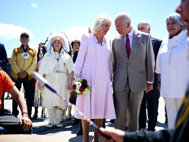 King Charles III and Queen Camilla react as they listen to drums being played after they landed at Macdonald-Cartier International Airport in Ottawa. Picture: AFP