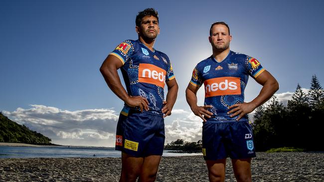Titans players Tyrone Peachey and Tyrone Roberts wearing indigenous jerseys at Tallebudgera Beach creek. Picture: Jerad Williams