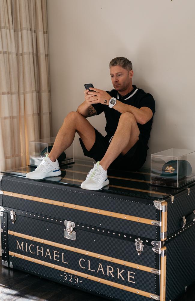Australian cricket captain, Michael Clarke, gestures to a Louis Vuitton  cricket trunk in Sydney on Tuesday, Oct. 16, 2012. The trunk was designed  in collaboration with Clarke and will be auctioned with