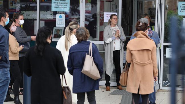 Parents arrive at St Charles in Waverley to pick up their children. Picture: John Grainger