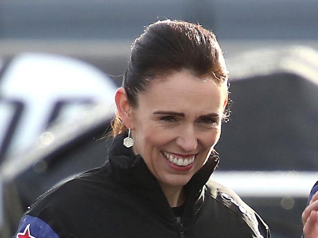 AUCKLAND, NEW ZEALAND - SEPTEMBER 06: Prime Minister Jacinda Ardern (C) looks over the Team New Zealand Americas Cup yacht, named Te Aihe with sailors Peter Burling (R) and Blair Tuke (L)  outside the Team New Zealand base during the launch ceremony on September 06, 2019 in Auckland, New Zealand. It was the first AC75 launched by any of the five teams that will be involved in the 2021 Americas Cup in Auckland. (Photo by Phil Walter/Getty Images)