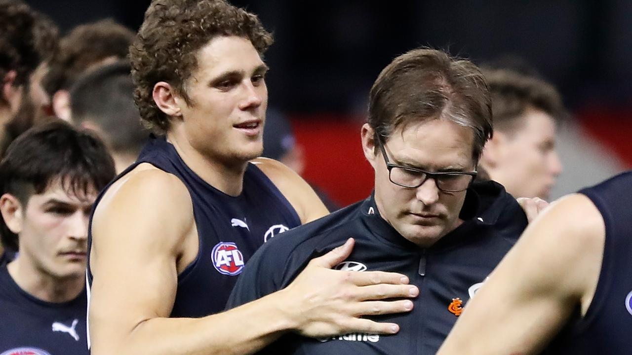 MELBOURNE, AUSTRALIA - AUGUST 21: David Teague, Senior Coach of the Blues is consoled by Charlie Curnow of the Blues at three quarter time during the 2021 AFL Round 23 match between the Carlton Blues and the GWS Giants at Marvel Stadium on August 21, 2021 in Melbourne, Australia. (Photo by Michael Willson/AFL Photos via Getty Images)