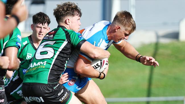 Pride's Kaiden Lahrs puts in a strong run in the Mal Meninga Cup Under 19 men's Queensland Rugby League match between the Northern Pride and the Townsville Blackhawks, held at Barlow Park. Picture: Brendan Radke