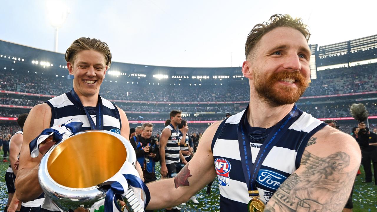 Zach Tuohy (right) will retire after he became one of three Irish-born players to win an AFL premiership when the Cats saluted in 2022. Picture: Daniel Carson / Getty Images