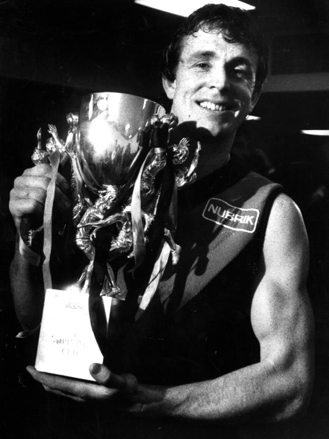 Essendon captain Terry Daniher with the Sterling Cup trophy.