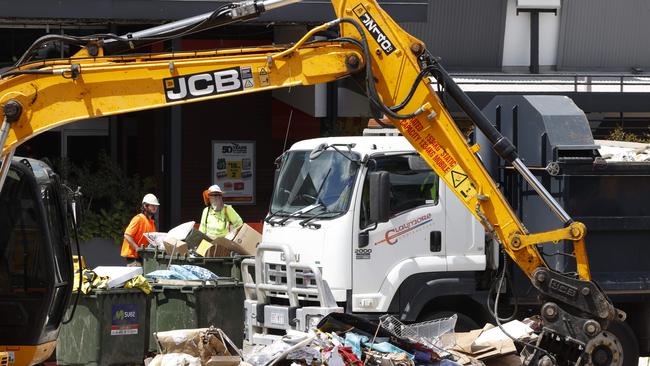 The clean up at Toombul Shopping Centre following the flood. Picture Lachie Millard