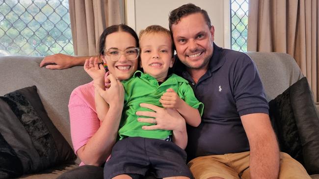 Toowoomba five-year-old Alfie Bell, pictured with his dad Nathan and mum Molly, has currently been left without a school to attend due to his complex disabilities, which have been deemed too difficult for the Diocese of Toowoomba Catholic Schools but are not severe enough for the special schools system.