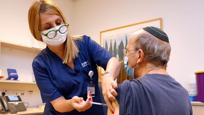 A man receives a third dose of the Pfizer vaccine at a clinic near Tel Aviv in Israel. Picture: AFP