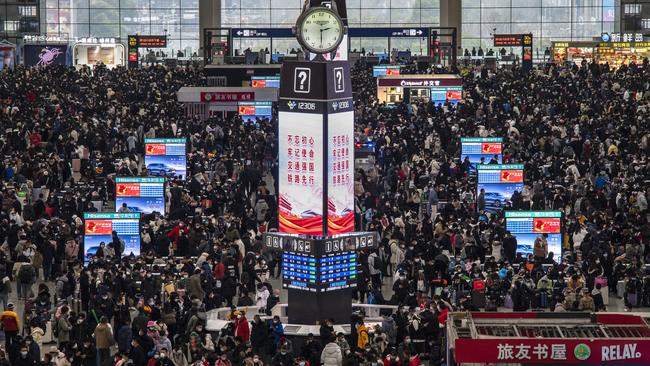 Travellers crowd at the gates and wait for trains at the Shanghai Hongqiao Railway Station during the peak travel rush for the upcoming Chinese New Year holiday. Picture: Getty Images