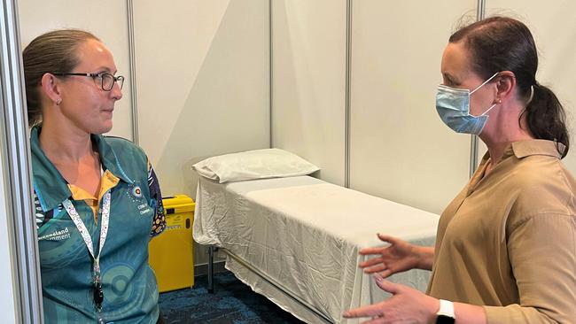 Queensland Health worker Tracy McKenzie talks with Health and Ambulance Services Minister Yvette D'Ath at the Cairns Convention Centre on Thursday. Picture: Peter Carruthers