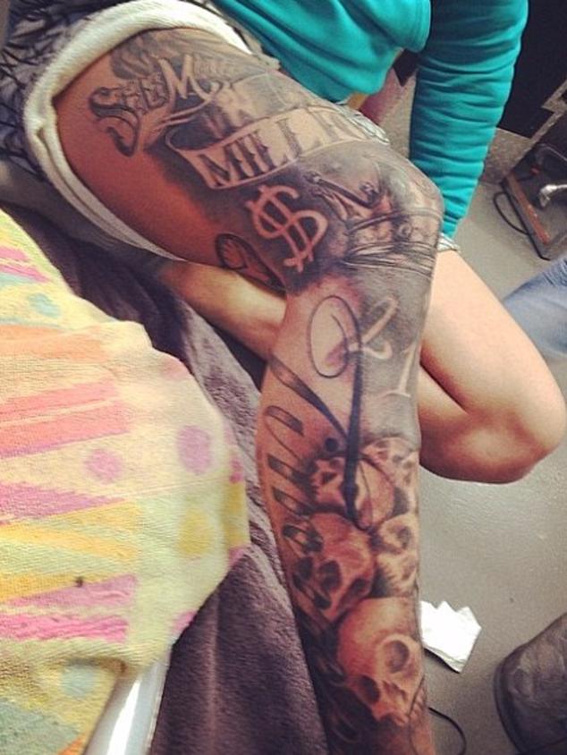 The tattooed leg with ‘SM’ and ‘millionaire.