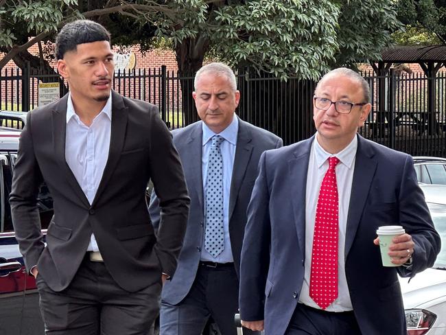 Dragons player Junior Amone, his manager Mario Tartak and his lawyer Elias Tabchouri entering Wollongong Local Court on Friday, August 18, 2023. Picture: Dylan Arvela