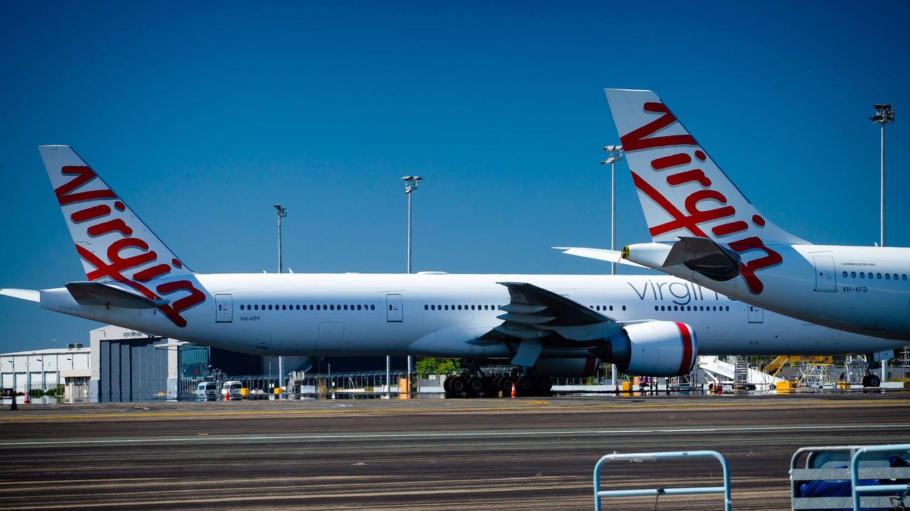 Virgin Australia aircraft parked on the tarmac at Brisbane Airport. Picture: Patrick Hamilton/AFP