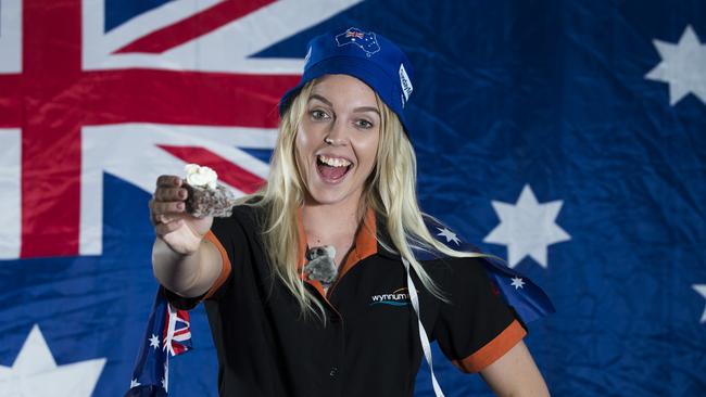 Alex Bishop poses with a lamington at Wynnum RSL. Picture: AAP Image/Renae Droop