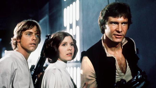 Mark Hamill as Luke Skywalker, Carrie Fisher as Princess Leia and Harrison Ford as Han Solo in Star Wars.