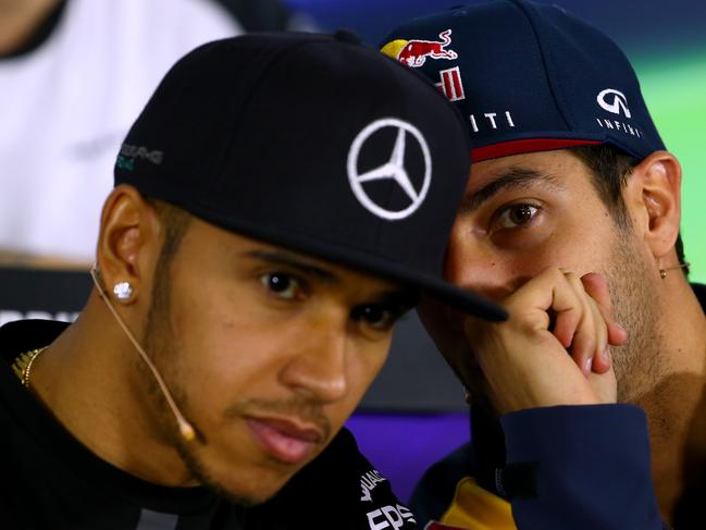 Daniel Ricciardo of Australia and Infiniti Red Bull Racing speaks with Lewis Hamilton of Great Britain and Mercedes GP at the drivers' press conference during previews to the Australian Formula One Grand Prix. Picture: Robert Cianflone/Getty Images