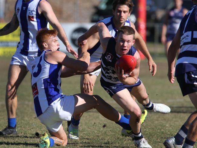 Round 13 QAFL Aussie rules game between Broadbeach and Mt Gravatt in 2018. Cats Kai Sheers breaks away from Vultures Zac Stone. Picture Glenn Hampson