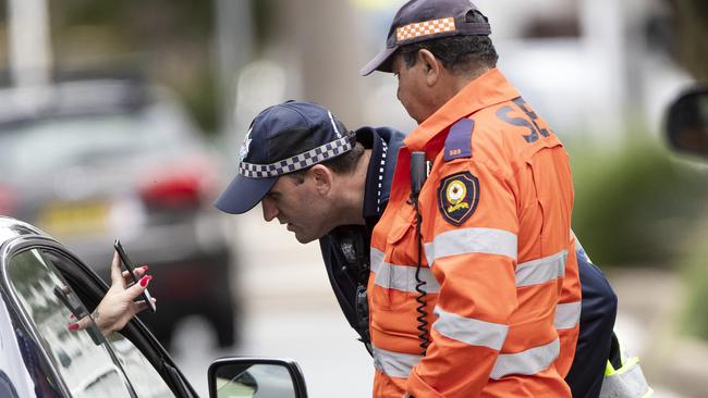 Police and army at the Queensland border. Picture: NIGEL HALLETT