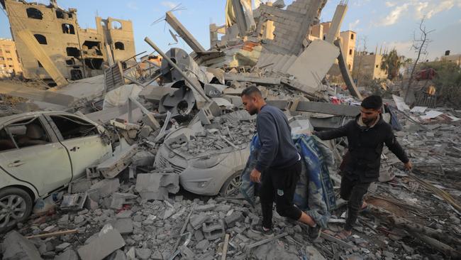 Gaza’s Abu Mershud family searches the debris of their home destroyed in an Israeli airstrike that killed seven relatives. Picture: Hassan Jedi/Anadolu via Getty Images