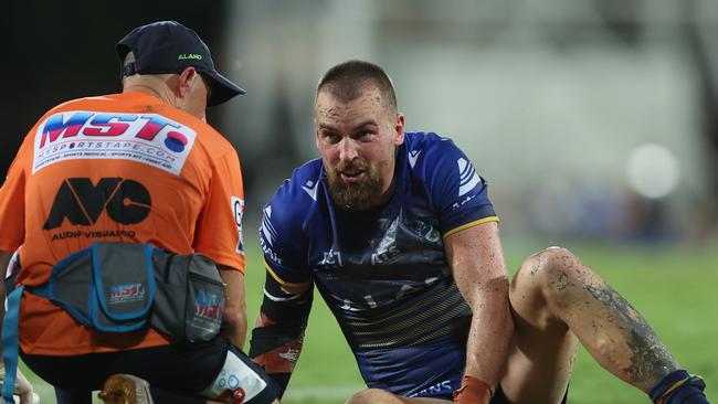 DARWIN, AUSTRALIA - APRIL 19:  Clint Gutherson of the Eels is attended to by a trainer after an injury during the round seven NRL match between Parramatta Eels and Dolphins at TIO Stadium on April 19, 2024, in Darwin, Australia. (Photo by Mark Metcalfe/Getty Images)