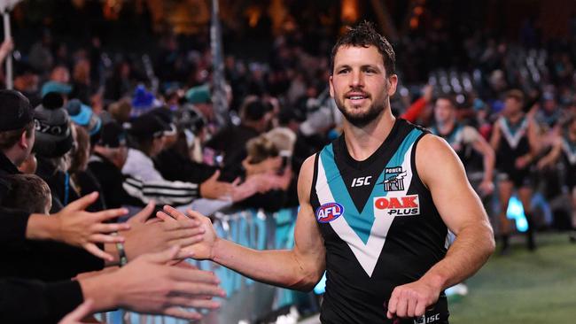 Travis Boak thanks fans after the win against North Melbourne. Picture: AAP Image/David Mariuz