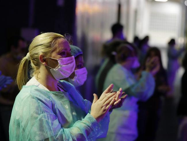 Health workers applaud in support of the medical staff that are working on the COVID-19 virus outbreak at La Paz hospital in Madrid, Spain. Picture: AFP