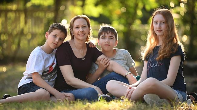 Breast cancer sufferer Susan Reilly doesn’t want children Liam, 11, left, Jacob, also 11, and Charlotte, 14, to see what she saw with her mother. Picture: Lyndon Mechielsen