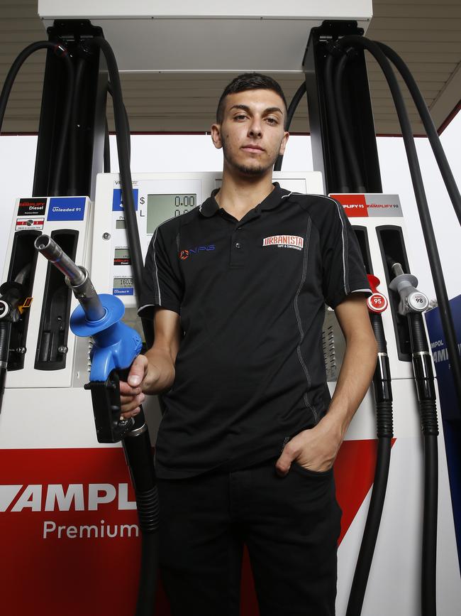 Ted Nader works at his dad Eddy’s Ampol service station at Smeaton Grange, where the rise in petrol prices is leading to a rise in thefts. Picture: John Appleyard