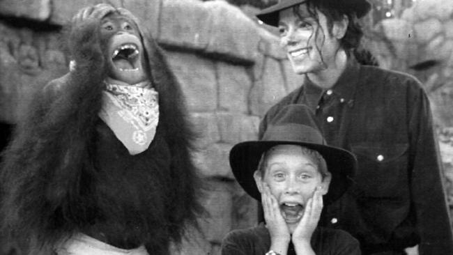Michael Jackson and Macaulay Culkin monkey around with Ginny the Orangutan at Universal Studios in 1991.
