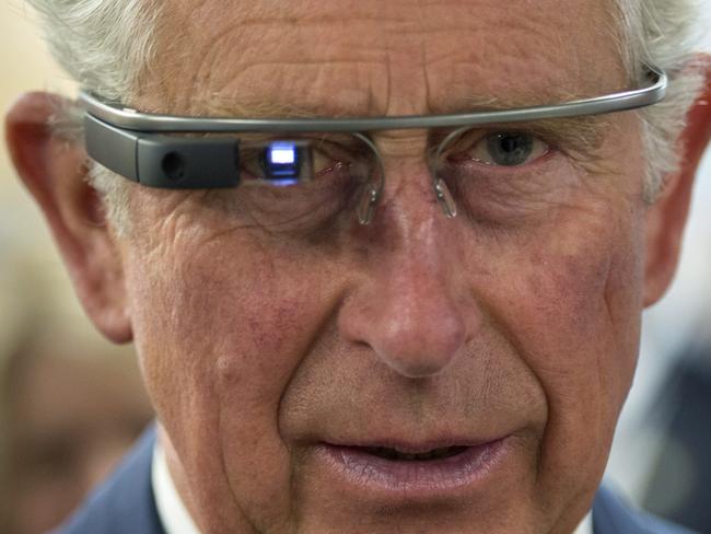 Prince Charles tries on Google Glass in Winnipeg, Canada.