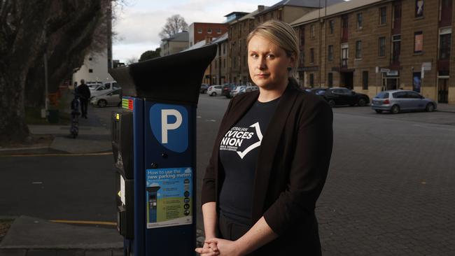 Sam Batchelor Tasmanian co-ordinator Australian Services Union with a parking meter in Salamanca Place. Hobart City Council parking officers say the city's parking management system is not working properly and they are stressed because they're issuing fines to people who have done nothing wrong. The council has strongly defended the accuracy of the system Picture: Nikki Davis-Jones