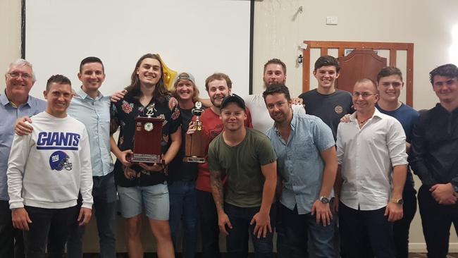 Bribie Tigers senior men’s team with their trophies. Left to right Bob Hamblin, Tommy Peak, Francis McDonnell, Callum Bowler, Carrick Knyviett, Andy Horsefield, Ben Stone, Eric O'Brien, Justin Lucas, Chris Stuart-Abrahams, John Aldous, Sam Johnston, Zac Fellows. (Absent Matthew Huntley, Joe McNulty, Craig Davey the coach)