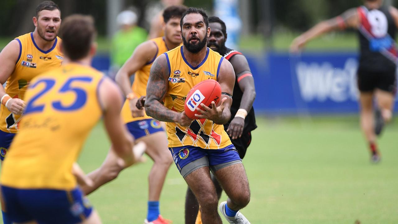 Wanderers' Nathan Djerrkura fires out a handpass. Picture: Felicity Elliott/AFLNT