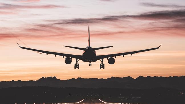 An airplane moments from touching down on the runway at sunrise.Photo - istockEscape 2 July 2023