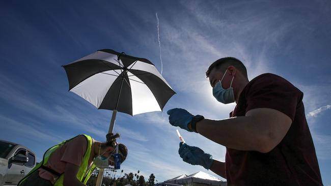 Doctor Richard Dang, assistant professor USC School of Pharmacy, prepares a COVID-19 vaccine as mass-vaccination of healthcare workers starts at Dodger Stadium on January 15 in Los Angeles, California. Picture: AFP