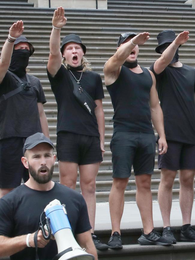 Nathan Bull performed the Nazi salute along with other National Socialist Network members during a Melbourne protest this weekend. Picture: NCA NewsWire/David Crosling