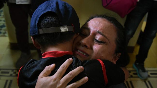 Lourdes de Leon hugs her son Leo — one of three minors who had been separated from their family on the US border — upon arrival at the shelter in Guatemala City. Picture: AFP