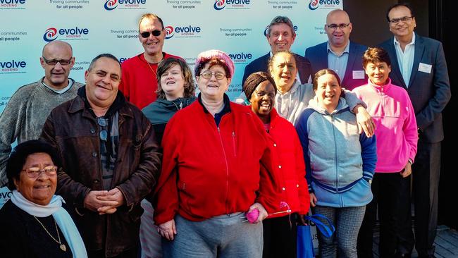 Some of the residents of the new Kings Landing apartment block with Evolve Housing CEO Lyall Gorman, Canterbury Bankstown Mayor Khal Asfour and Evolve Housing general manager community business and growth Jitender Balani. Picture: Robert Costa