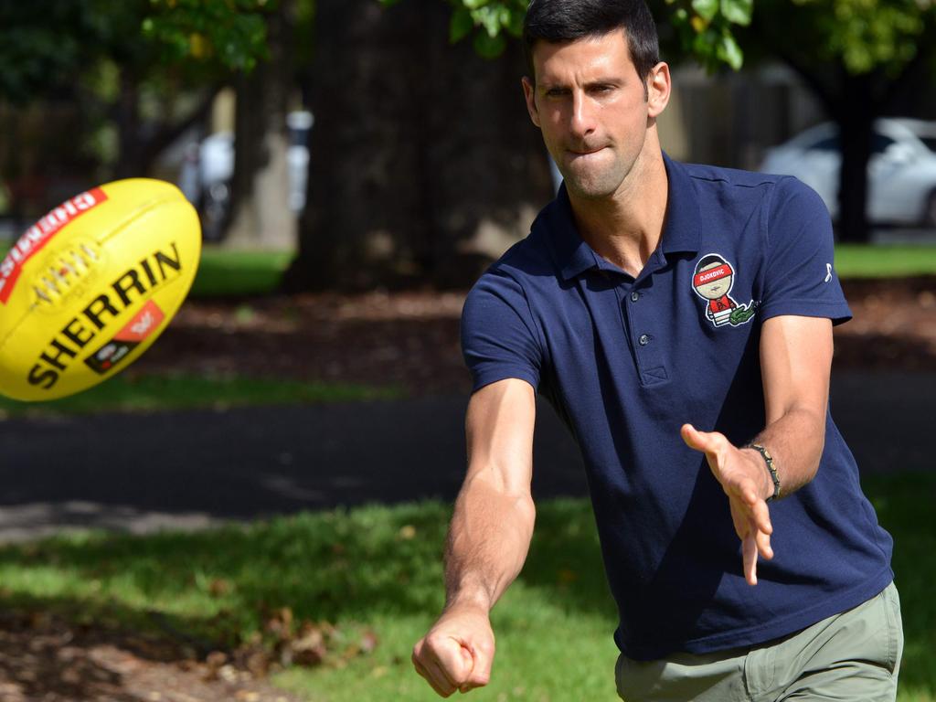 Novak Djokovic of Serbia plays with a Sherrin after two weeks in quarantine.