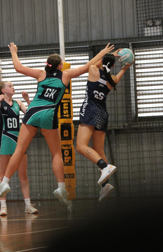 Netball action from QISSN 2024, Townsville. Canterbury's Harmony O'Brien and Matthew Flinders' Sophie Boud