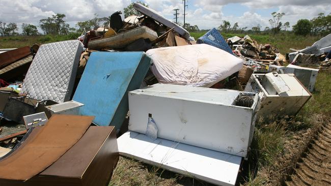 A huge pile of water damaged furniture and white goods at Bajool after flash flooding ripped through the small town south of Rockhampton. Picture: Chris Ison