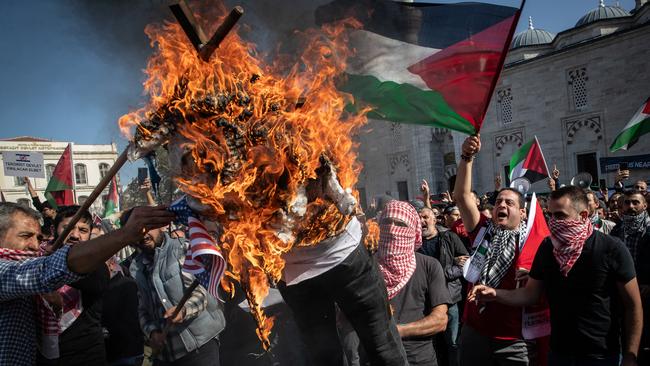 Pro Palestinian protesters burn an effigy of Israeli Prime Minister Benjamin Netanyahu in Istanbul, Turkey. Picture: AFP