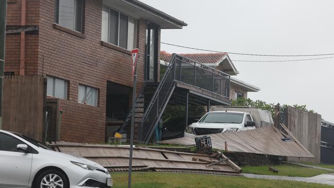 A fence destroyed in Whiting St, Labrador. Picture Glenn Hampson