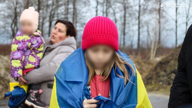 Children reunite with family members after being held in Russian-occupied territories.