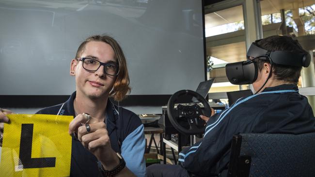 Clifford Park Special School students Seth Jennings (left) and Harley Deller use a learn to drive virtual reality hub, donated by the Endeavour Foundation, aimed at getting as many students as possible on the path to independence. Picture: Kevin Farmer