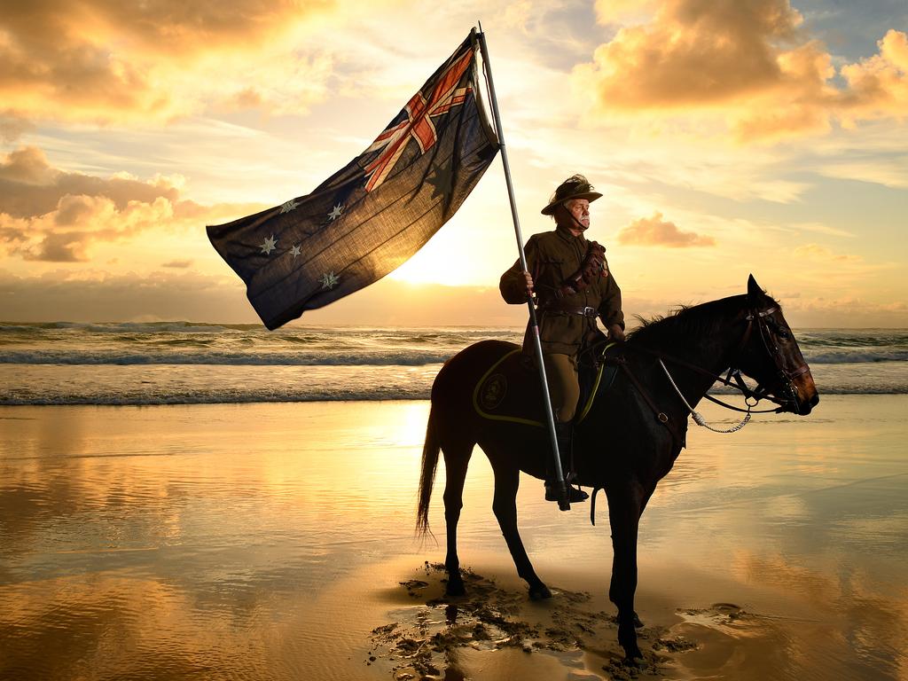 In memory of the Australian Army Veterinary Corp (AAVC), Chris Kennedy and his horse Chaos are seen at Currumbin Beach on the Gold Coast, Tuesday, April 23, 2019. The AAVC played a vital military role, from the Sudan and South African wars, through World War I and to the end of World War II. Veterinarians and their assistants provided professional care for horses, mules, camels, dogs and pigeons in the Australian Army, with 120 officers serving overseas in WWI. Kennedy and Chaos will participate in the annual Anzac Day dawn service at Currumbin Beach on Thursday. (AAP Image/Dave Hunt) NO ARCHIVING, EDITORIAL USE ONLY